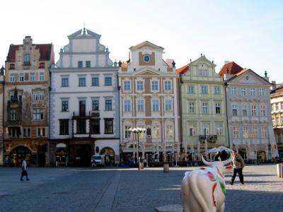 an array of yellow, ochre, pink and grey buildings in Old Town Square