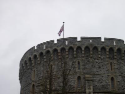 The Queen is not home. (If she was, the Royal Standard would be flown, not the Union Jack.)