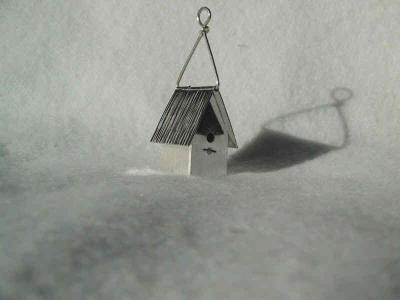 This birdhouse stands 3 cm high (not including the hanger), and is about 1.5 cm square at the bottom.  The roof is hinged to open. This is a little large for a pendant - it's just an ornament.