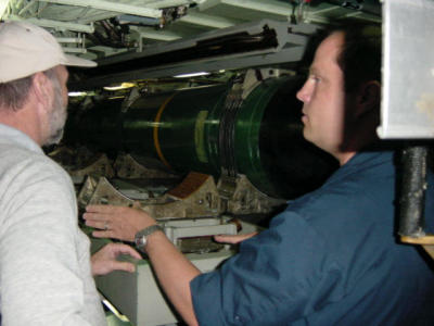 Mike showing Brant a torpedeo