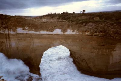 Years of surf and erosion cut a huge hole through this rock