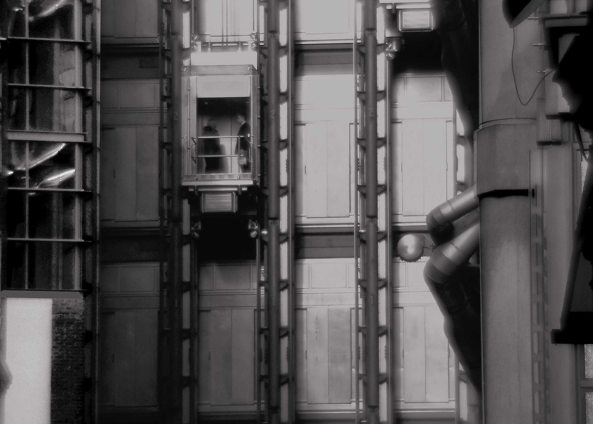 two men in a lift