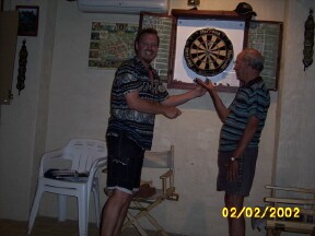Zo with the local Darts Champ, Gerry