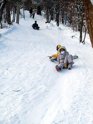 Sliding down the mountain is easier that hiking up!