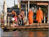 Monks waiting for water taxi