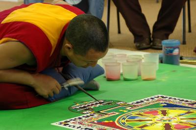 monk making sand mandala