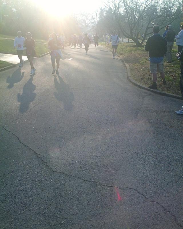Runners coming down the hill - looking back along the course