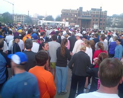 Crowds of runners milling about prior to the start