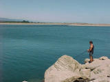 fishing at the Hokitika river mouth.