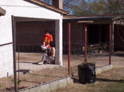 Chris giving a kit to another person.