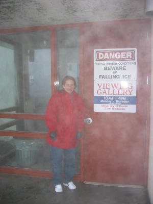 Chelle at the entrance to the UH telescope. Good thing we brought appropriate clothing as it is 33 F and 40 mph winds.