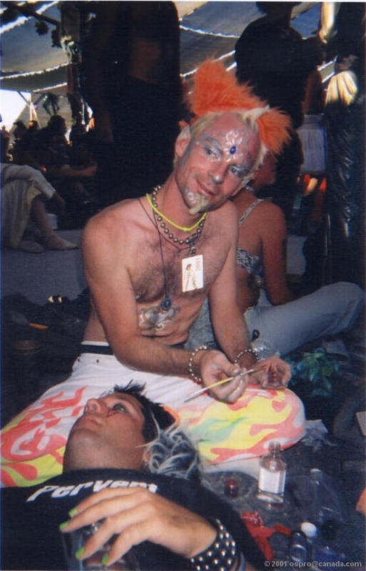 Sunshine applies paint to Mr. Marrrrvelous (the wonder formerly known as Sleazy)