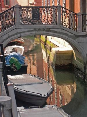 Reflection under the bridge in Venice by Luca Gemelli