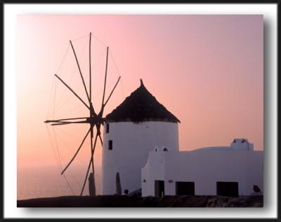 greek windmill at sunset