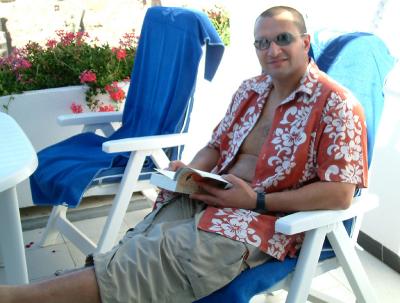 Mark Reading In Sun On Balcony