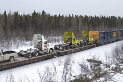 Trucks leaving Moosonee by rail