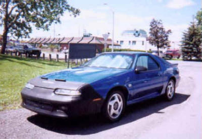 This car was bought new in... 1996 ! It was in the Baillot (the dealer) showroom for 4 years or so when he bought it. It now resides in  Gatineau Quebec, Canada.  It is the only Canadian Export Blue Iroc R/T!