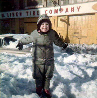 Nora In front of Liben Tire Co, age 4