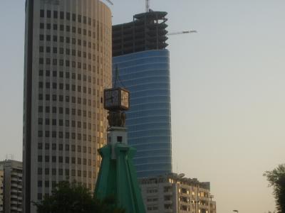 Roundabout clock, high rises