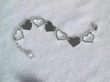floating hearts bracelet sold