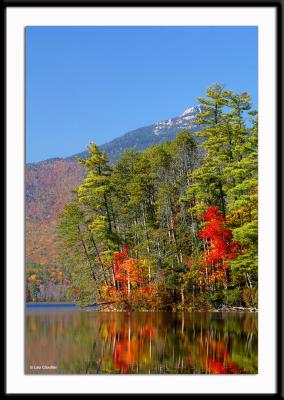 Chocorua Lake with its brilliant foliage just below the mountain of the same name in Tamworth, New Hampshire.