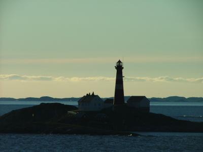 A lighthouse - with Lofotveggen in the background