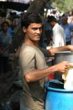 Washing the dishes at a street restaurant