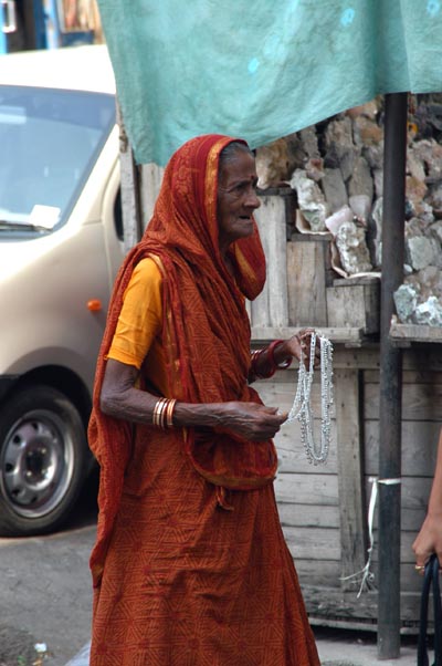 Woman selling jewelry on the street, Colaba