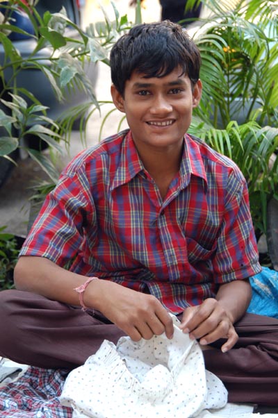 Boy selling shorts, Mumbai, India