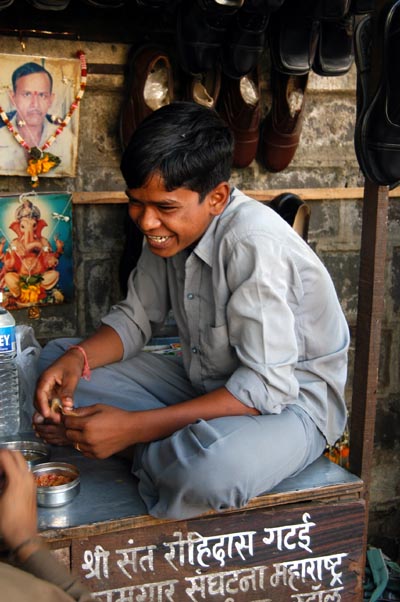 Boy working a stall on Dr. D.N. Road