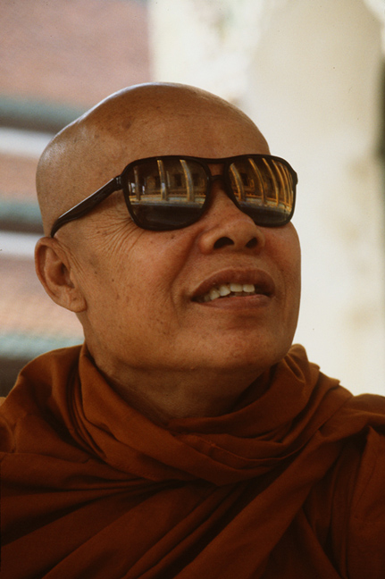 So this monk at the Grand Palace gestures to me to pass him my sunglasses. No problem.