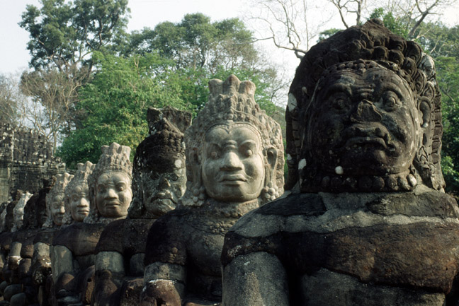  Roadside sentinels, Angkor Thom. Note the reconstuction on some of the heads.