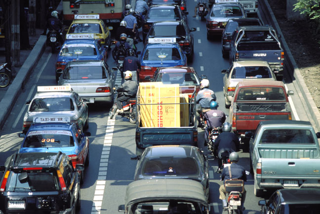  Bikes make their own trail through traffic.