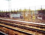Rusty tracks and a brickwall