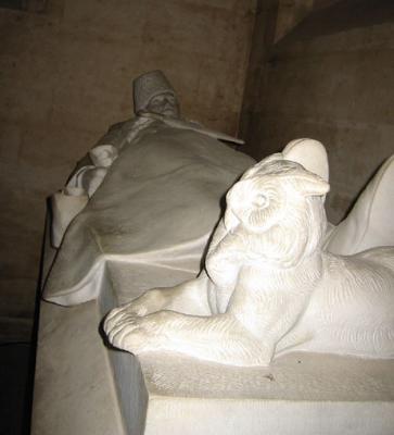 One of several effigies with animals at their feet