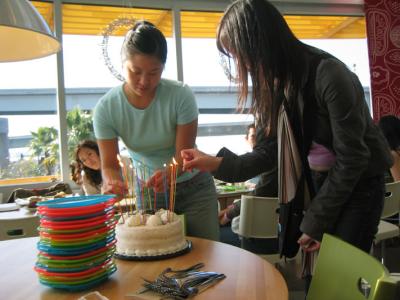 the girls light the old man's cake