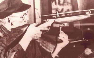 Axel Peterson Testing A Ballard Rifle In His Shop.