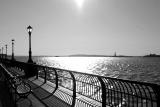 Hudson River Promenade with Statue of Liberty and Verrazano Bridge on the Distant Horizon