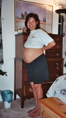 Tricia showing off her belly at about 39 weeks into her pregnancy