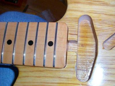 The necks on.  The channel aids in truss rod access