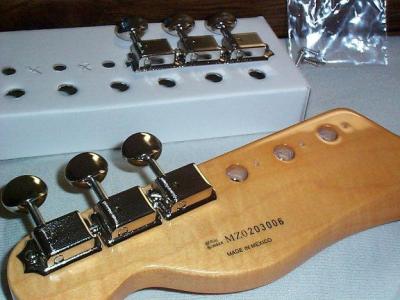 The Vintage style tuners just screw on (slotted)