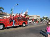 John P. Squibob Fire Department dousing the bystanders