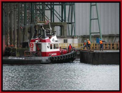 Passing bow lines to shore crew.