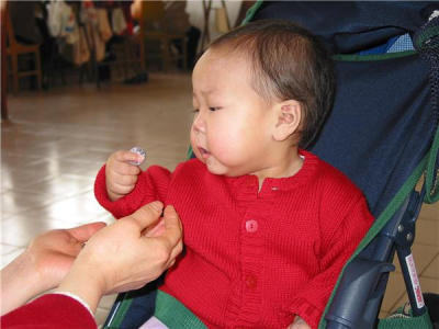 Anna holding coin
