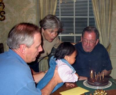 Anna helping Da blow out his candles