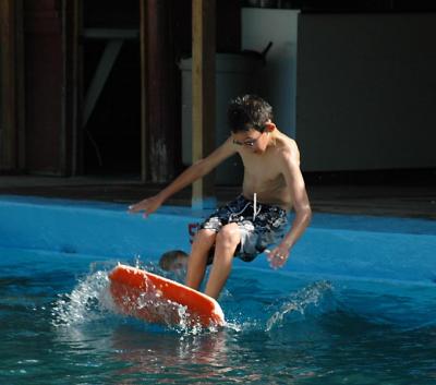 Hey- it ain't easy boogie boardin' in a pool!