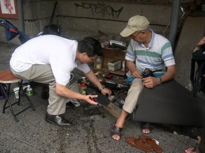 Shoe repairer in Chinatown