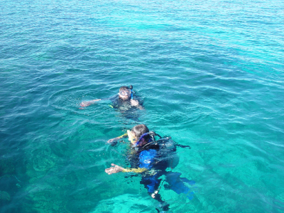 IN THE WATER NEAR THE DIVE BOAT WITH MY DIVE BUDDY