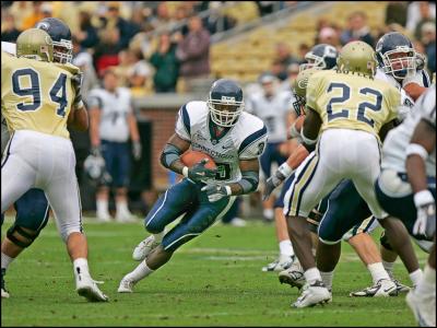 04-Cornell Brockington of UCONN hits the hole.jpg