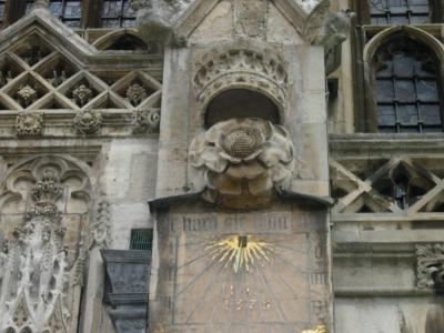 The crowned Tudor rose above a sundial.